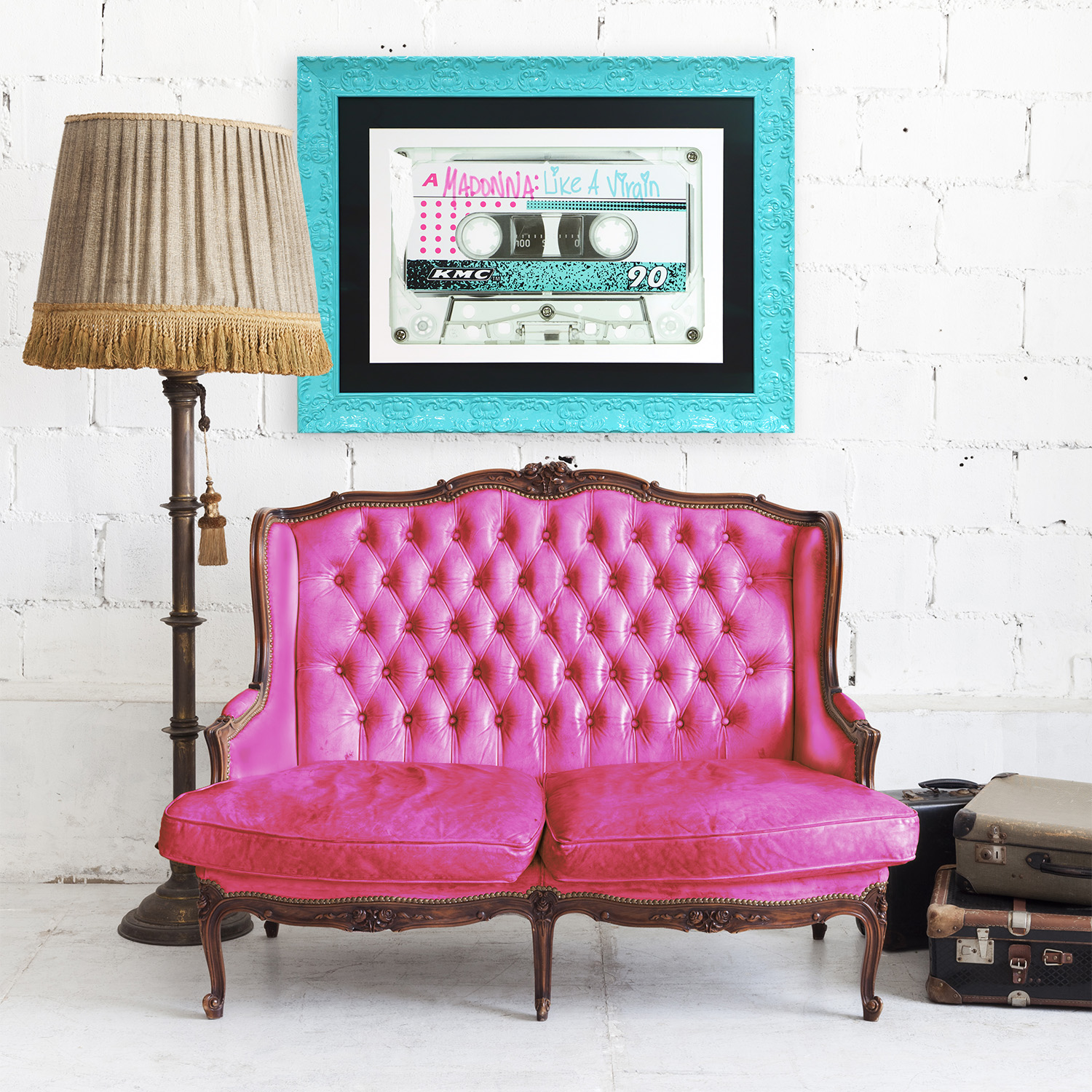 Madonna Print Framed in Aqua Blue frame hanging above hot pink couch.
